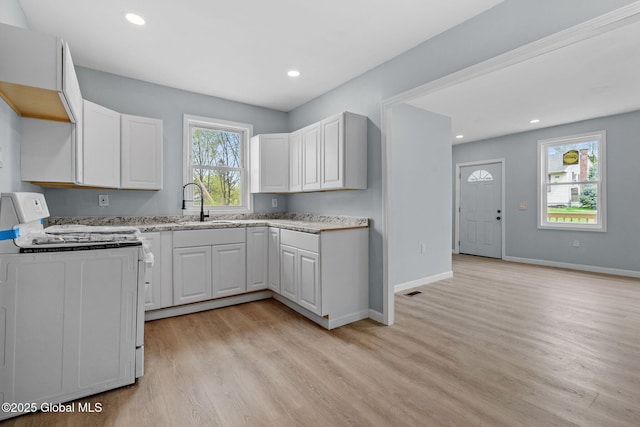 111 Mann Ave, Troy, NY 12180 - kitchen featuring recessed lighting, stove, and light wood-type flooring