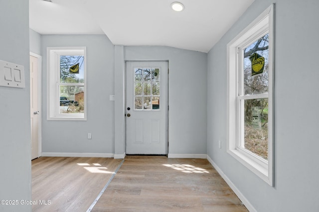 111 Mann Ave, Troy, NY 12180 - entryway with baseboards, vaulted ceiling, and light wood-style flooring