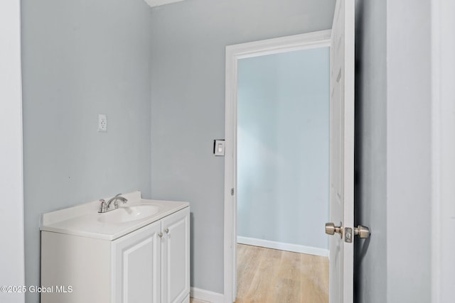 111 Mann Ave, Troy, NY 12180 - bathroom with vanity, baseboards, and wood finished floors