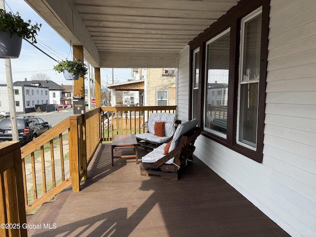 balcony featuring a residential view and covered porch