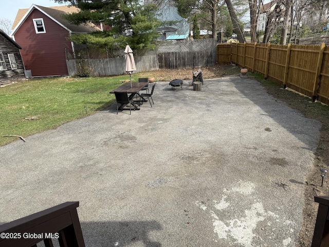 view of patio / terrace featuring a fenced backyard and an outdoor fire pit