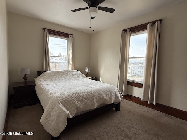 bedroom featuring ceiling fan and baseboards