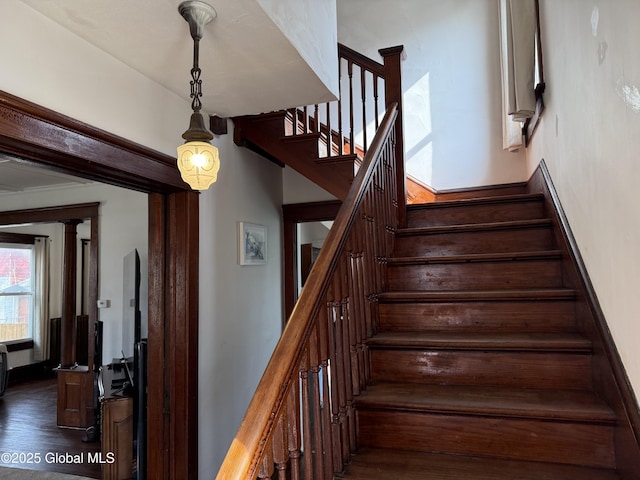 stairway with wood finished floors