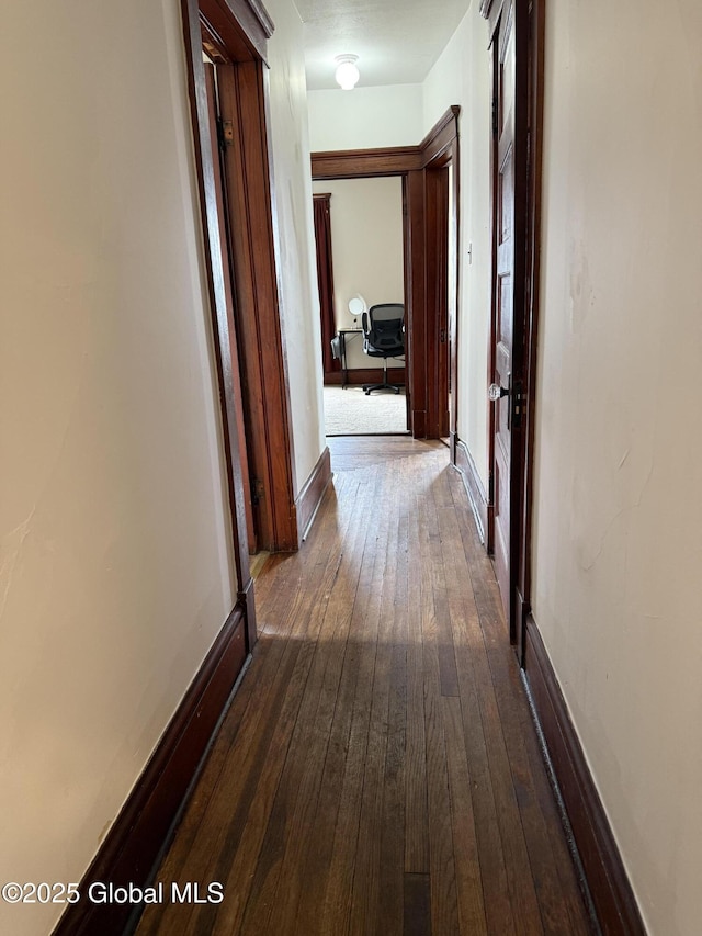hall featuring dark wood-type flooring