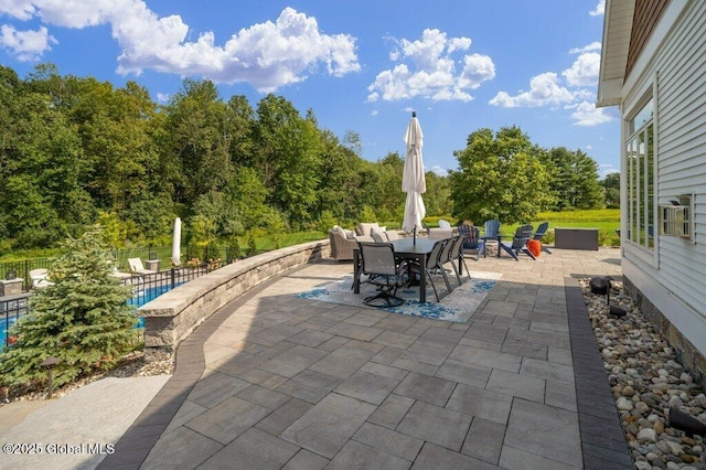 view of patio with fence and outdoor dining space