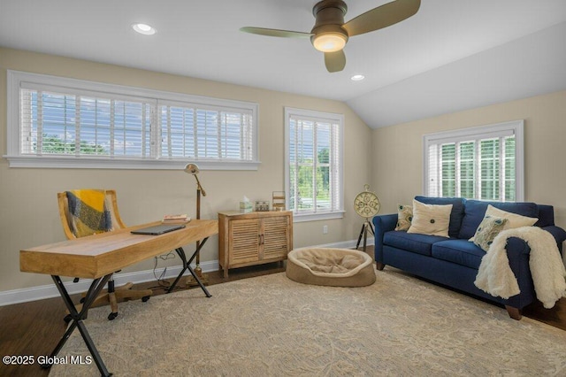 office with baseboards, plenty of natural light, a ceiling fan, and wood finished floors