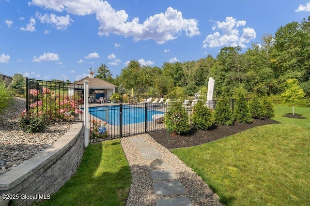 view of swimming pool with fence, a fenced in pool, and a yard