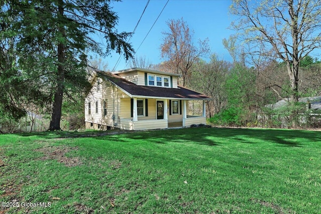 view of front of home with covered porch and a front yard
