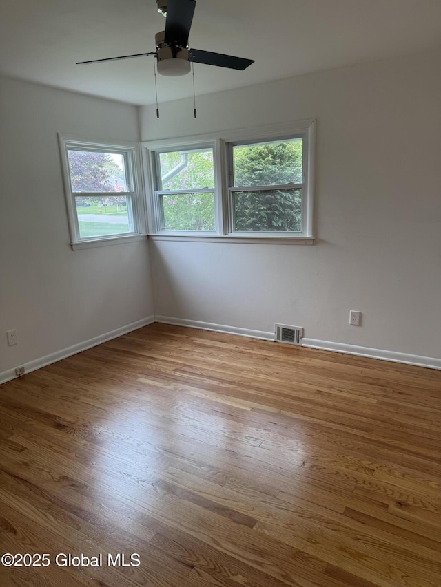 19 Callaghan Blvd, Charlton, NY 12019 - empty room with wood finished floors, ceiling fan, and baseboards