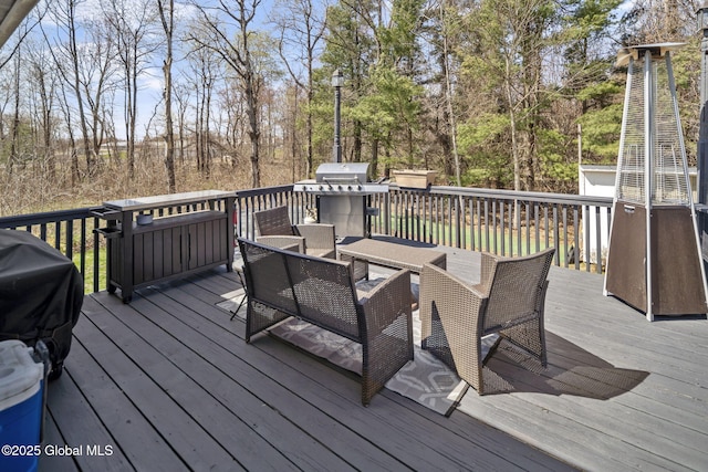 wooden terrace with grilling area and outdoor lounge area