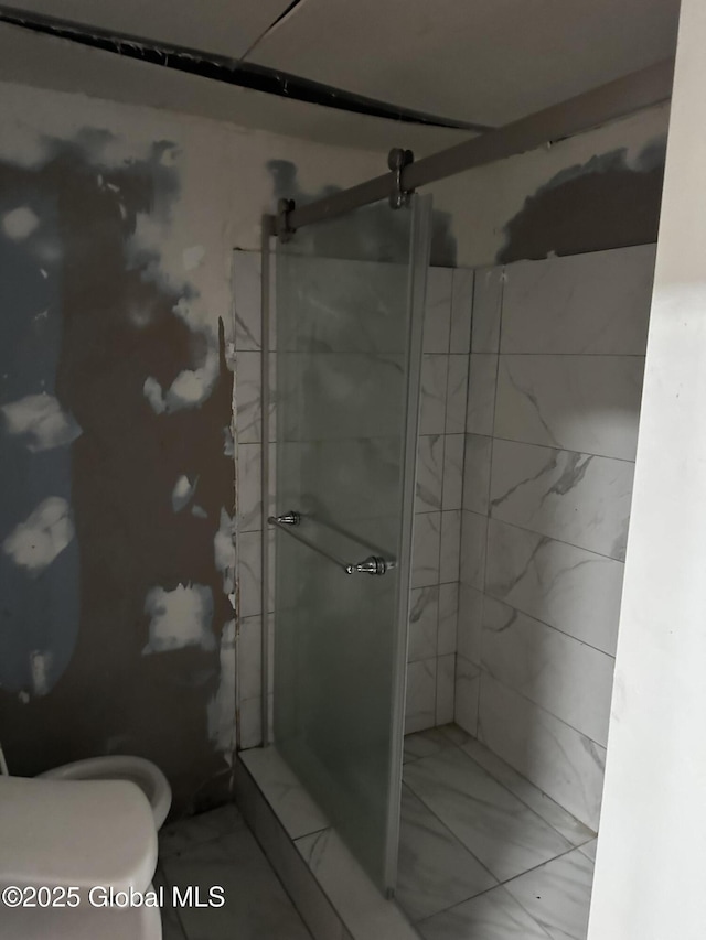 425 10th St, Troy, NY 12180 - bathroom featuring a shower stall, marble finish floor, and toilet