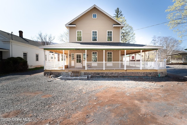 farmhouse-style home featuring a porch