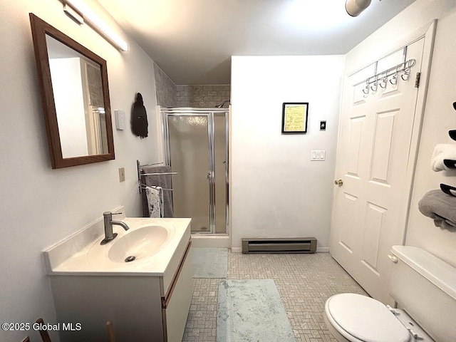 bathroom featuring a baseboard heating unit, a shower stall, toilet, and vanity