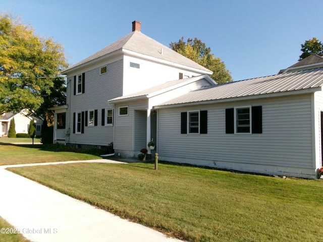 401 S 1st St, Northville, NY 12134 - exterior space featuring a chimney and a front lawn