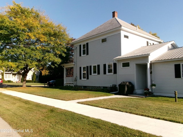 401 S 1st St, Northville, NY 12134 - view of side of home with a lawn and a chimney