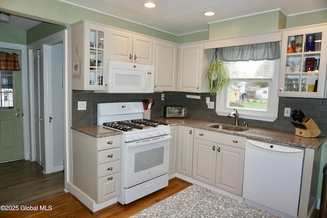 401 S 1st St, Northville, NY 12134 - kitchen with white cabinets, a sink, glass insert cabinets, wood finished floors, and white appliances