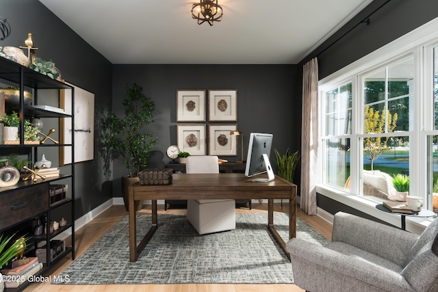 office area featuring baseboards and wood finished floors
