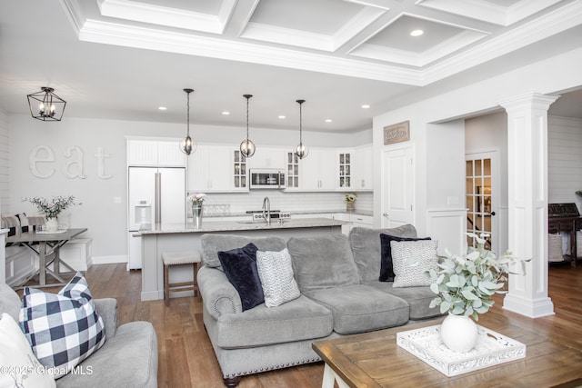 living area featuring recessed lighting, coffered ceiling, and dark wood finished floors