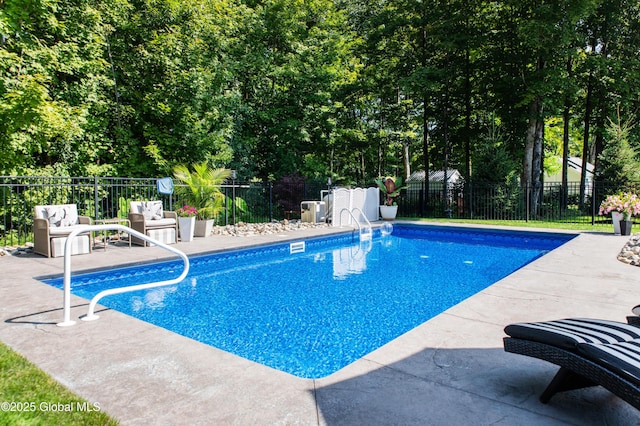 view of pool with a fenced in pool, fence, and a patio