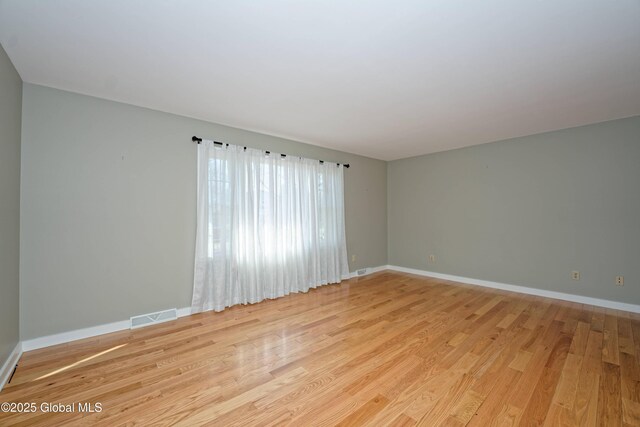 87 Dorchester Ave, Bethlehem, NY 12158 - unfurnished room with baseboards, light wood-style floors, and visible vents