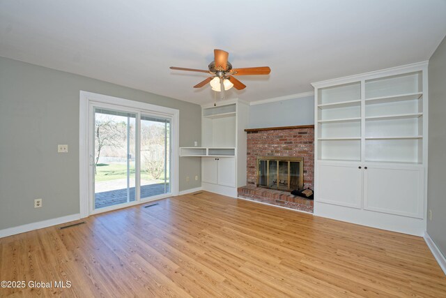 87 Dorchester Ave, Bethlehem, NY 12158 - unfurnished living room featuring baseboards, a ceiling fan, wood finished floors, and a fireplace