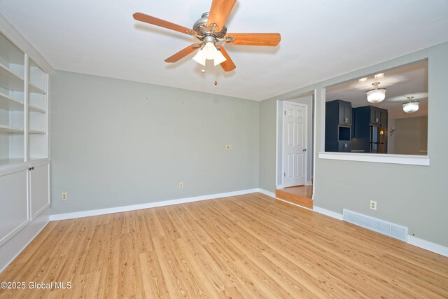 87 Dorchester Ave, Bethlehem, NY 12158 - unfurnished living room with light wood-style flooring, visible vents, baseboards, and ceiling fan