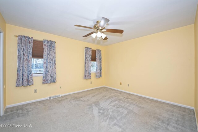 87 Dorchester Ave, Bethlehem, NY 12158 - carpeted spare room with baseboards, a ceiling fan, and visible vents