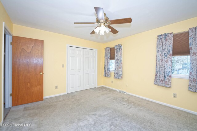 87 Dorchester Ave, Bethlehem, NY 12158 - unfurnished bedroom featuring carpet floors, multiple windows, visible vents, and a closet