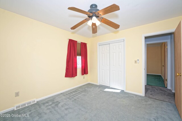 87 Dorchester Ave, Bethlehem, NY 12158 - unfurnished bedroom featuring carpet flooring, baseboards, visible vents, a ceiling fan, and a closet