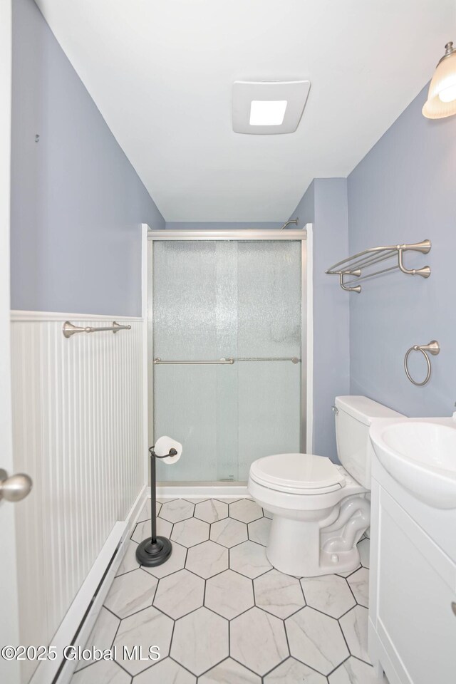 87 Dorchester Ave, Bethlehem, NY 12158 - full bathroom with toilet, vanity, tile patterned floors, and a stall shower