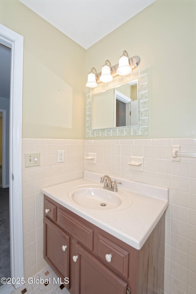 87 Dorchester Ave, Bethlehem, NY 12158 - bathroom with vanity, a wainscoted wall, and tile walls