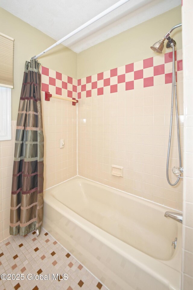 87 Dorchester Ave, Bethlehem, NY 12158 - bathroom featuring tile walls, tile patterned floors, and shower / bathtub combination with curtain