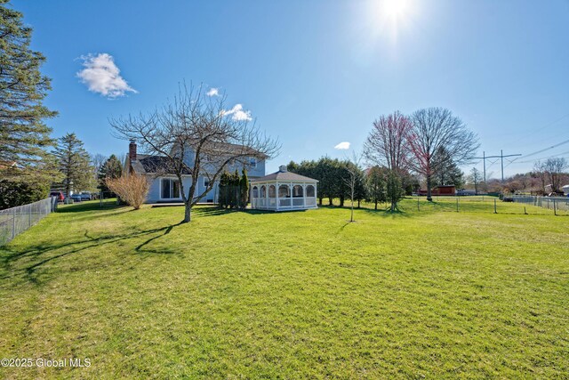 87 Dorchester Ave, Bethlehem, NY 12158 - view of yard featuring fence, a sunroom, and a gazebo