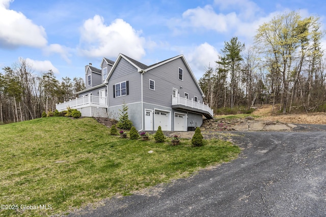 214 Vosenkill Rd, Athens, NY 12015 - view of side of home with a wooden deck, a yard, a garage, and driveway
