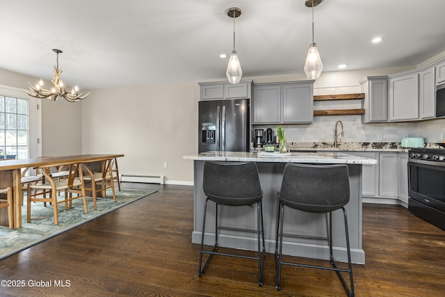 214 Vosenkill Rd, Athens, NY 12015 - kitchen featuring stainless steel fridge, gray cabinets, baseboard heating, and range with gas cooktop