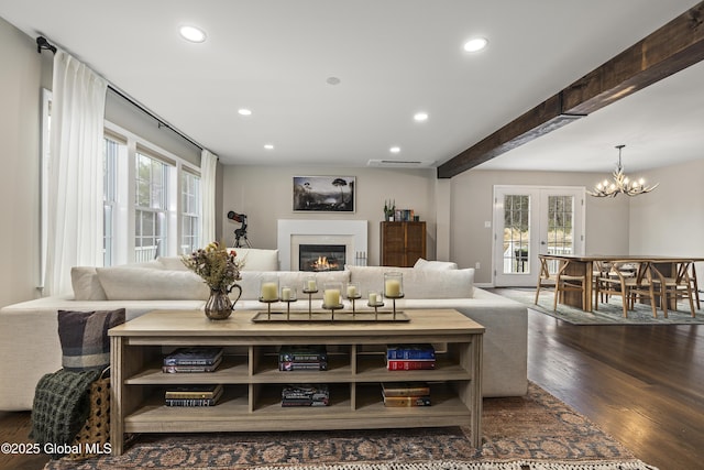 214 Vosenkill Rd, Athens, NY 12015 - living room with dark wood-type flooring, a glass covered fireplace, recessed lighting, and a notable chandelier