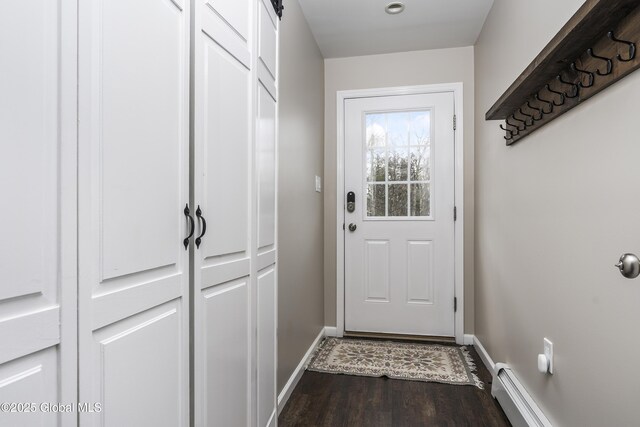 214 Vosenkill Rd, Athens, NY 12015 - doorway to outside featuring a baseboard radiator, dark wood-type flooring, and baseboards
