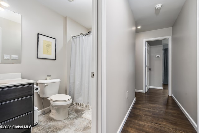 214 Vosenkill Rd, Athens, NY 12015 - full bath featuring a shower with curtain, baseboards, toilet, wood finished floors, and vanity