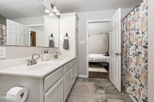 214 Vosenkill Rd, Athens, NY 12015 - ensuite bathroom with double vanity, a sink, stone finish floor, and ensuite bathroom