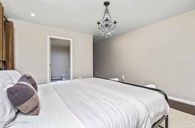 214 Vosenkill Rd, Athens, NY 12015 - bedroom featuring recessed lighting, wood finished floors, ensuite bath, baseboards, and a notable chandelier