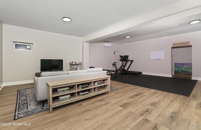 214 Vosenkill Rd, Athens, NY 12015 - living area with a wall mounted AC, wood finished floors, and baseboards