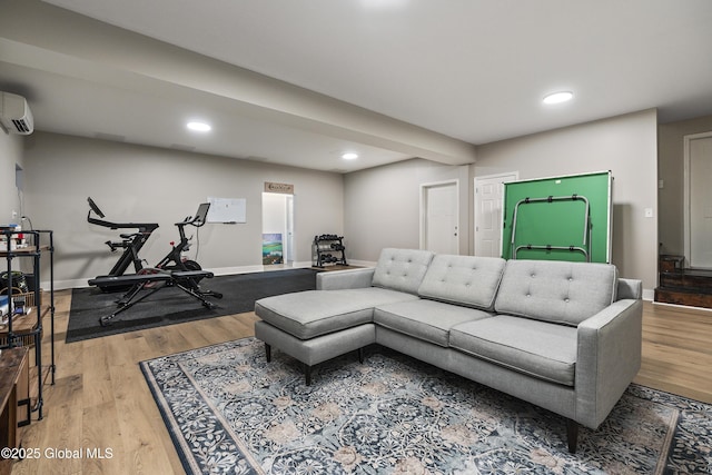 214 Vosenkill Rd, Athens, NY 12015 - living room with wood finished floors, recessed lighting, a wall mounted AC, and baseboards