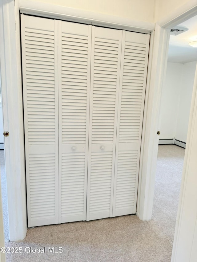 details with carpet flooring, baseboard heating, and visible vents