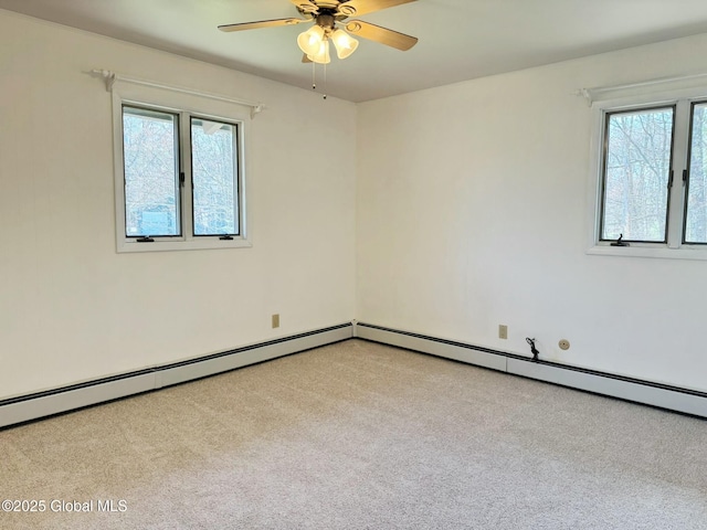 carpeted empty room featuring ceiling fan and a wealth of natural light