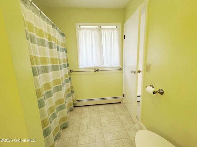 doorway to outside with a baseboard heating unit