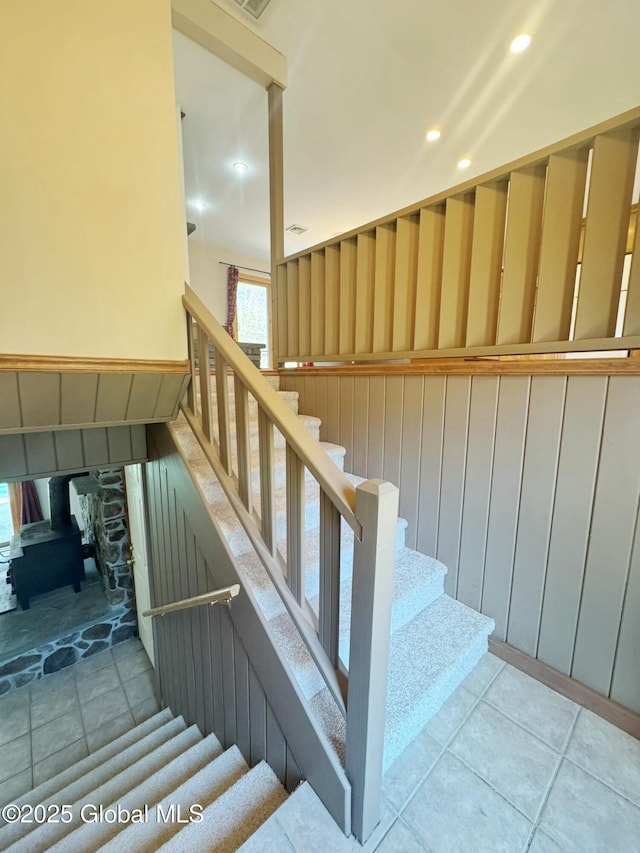 stairs featuring recessed lighting