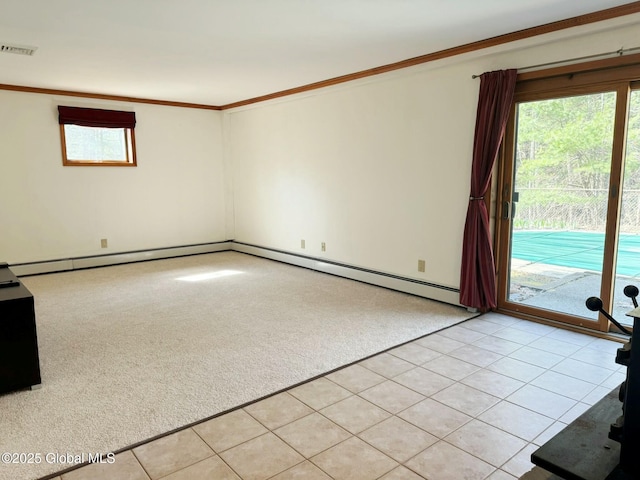empty room featuring ornamental molding, visible vents, light carpet, and a baseboard radiator