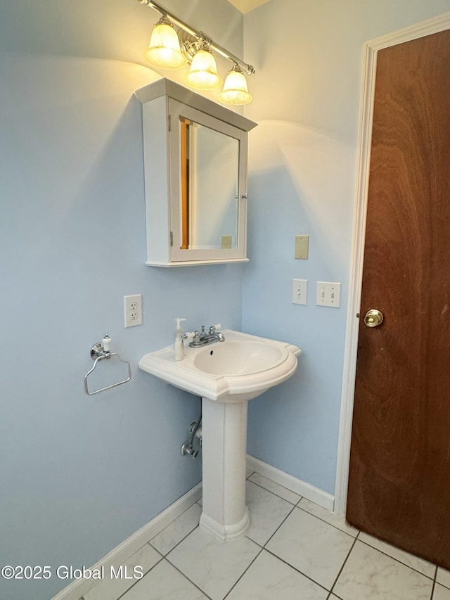 bathroom featuring baseboards