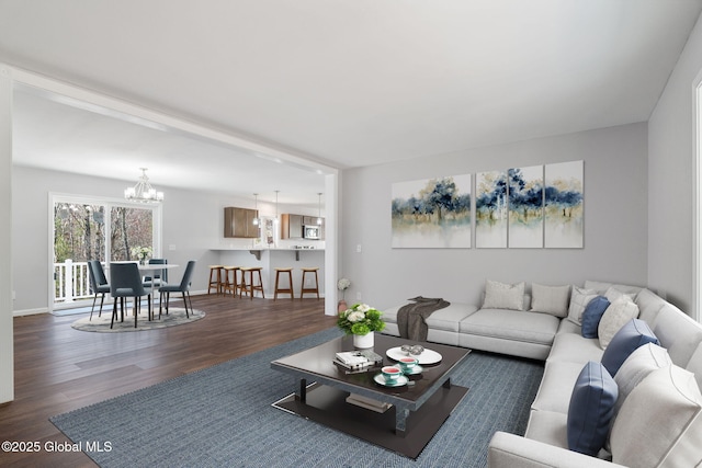 152 Ingersoll Rd, Wilton, NY 12866 - living area featuring a chandelier, dark wood finished floors, and baseboards