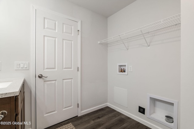 152 Ingersoll Rd, Wilton, NY 12866 - laundry area featuring hookup for a washing machine, electric dryer hookup, cabinet space, dark wood-style flooring, and baseboards